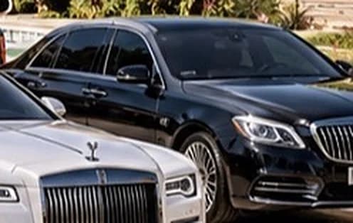 Black Mercedes-Maybach S-Class sedan, front three-quarter view